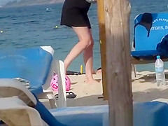 Girl on the beach dresses pants