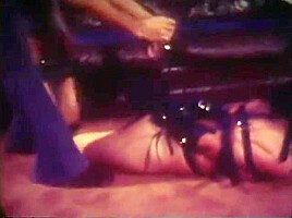 Girl tied by burglar with leather straps