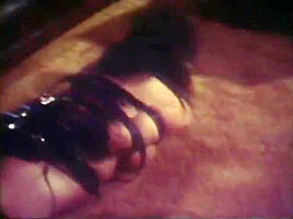 Girl tied by burglar with leather straps