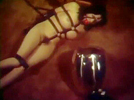 Girl tied by burglar with leather straps