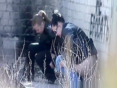 Girls peeing abandon place