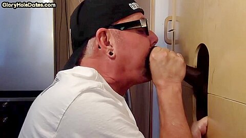 Gloryhole amateur DILF sucks black penis with greedy mouth