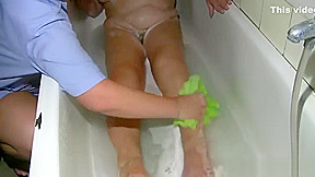 Grandmother is taking a bath