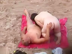 Horny matures caught at the nude beach
