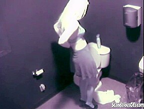 Hot Blonde fingering her pussy public toilet