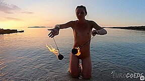 Hot Ginger Professional Fire Dancer Lea Playing With Her Flames On The Beach During Sunset