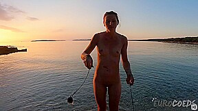 Hot Ginger Professional Fire Dancer Lea Playing With Her Flames On The Beach During Sunset