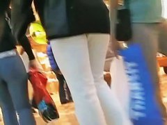 Hot brunette w/ a nice ass in a voyur porno pacing in a shopping mall