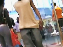 Hot brunette w/ a nice ass in a voyur porno pacing in a shopping mall