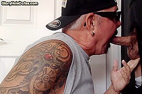 Inked gloryhole DILF sucks cock till jizz in greedy mouth