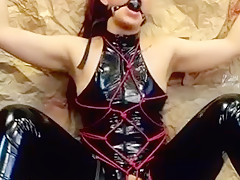 Latex Slavegirl Tied To Wall