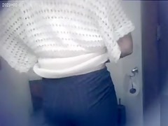 Lovely sweater on a cute woman going to the toilet