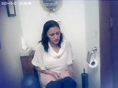 Lovely sweater on a cute woman going to the toilet
