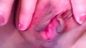Lusty babe touches her tits and rubs her cunt in bed
