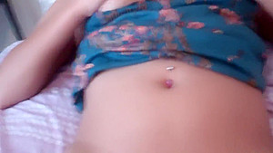 Lusty babe touches her tits and rubs her cunt in bed