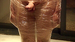 Male Slave Bound In Cling Wrap Gets Riding Crop Cbt By Two Gorgeous Femdoms