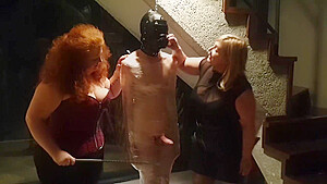 Male Slave Bound In Cling Wrap Gets Riding Crop Cbt By Two Gorgeous Femdoms