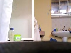 Milf with fatty belly and bushy cunt showering on