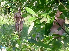 Naturist couple caught fucking in grass