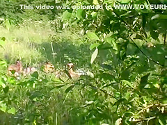 Naturist couple caught fucking in grass