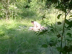 Naturist couple caught fucking in grass