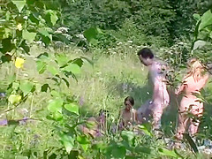 Naturist couple caught fucking in grass