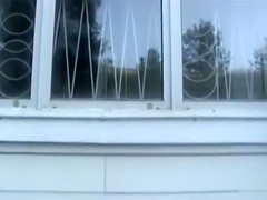 Naughtiest chick ever takes a piss from a window!