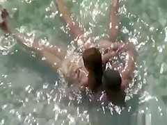 Nudist couple fucking in the water