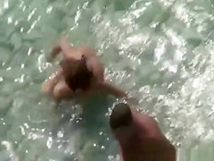 Nudist couple fucking in the water