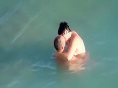 Nudists fucking in the water
