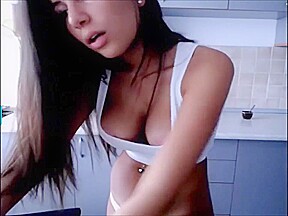 PRETTY SLIM GIRL IN HER KITCHEN