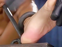 Redhead ebony slut in device pussy toyed