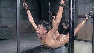 Restrained ebony sub drools during punishment