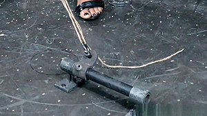 Restrained ebony sub drools during punishment