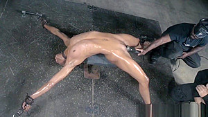 Restrained ebony sub drools during punishment