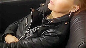 Rock chick posing in leather pants and classic leather biker jacket