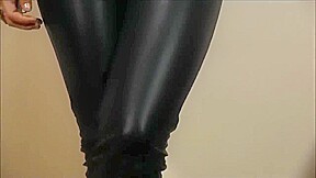 Rock chick posing in leather pants and classic leather biker jacket