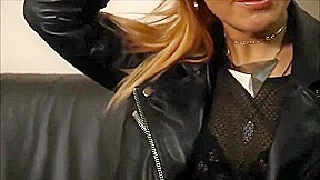 Rock chick posing in leather pants and classic leather biker jacket