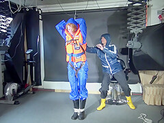 See Ronja Tied And Gagged By Stella In Shiny Nylon Rainwear And A Life Vest!