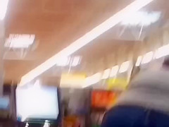 Sexy ass on brunnete milf in jeans at self checkout