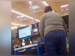Sexy ass on brunnete milf in jeans at self checkout