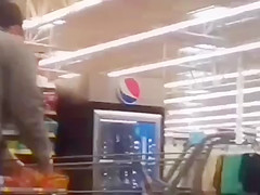 Sexy ass on brunnete milf in jeans at self checkout