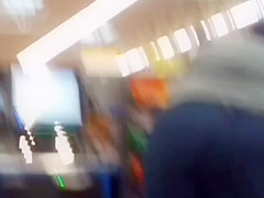 Sexy ass on brunnete milf in jeans at self checkout