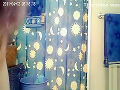 Skinny girl with sexy little tits takes a shower