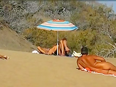 Slutwife masturbating for pervs in a beach