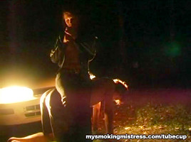 Smoking Mistress Sits on Slave