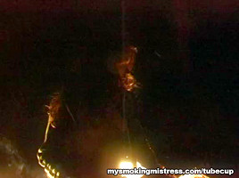 Smoking Mistress Sits on Slave