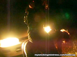 Smoking Mistress Sits on Slave