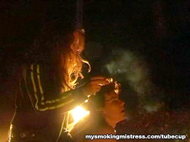 Smoking Mistress Sits on Slave