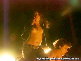 Smoking Mistress Sits on Slave